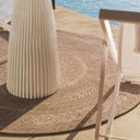 Durable round rug Whirlpool in Warm Sand on outside deck