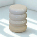 White ceramic side table with rounded shape and matte base. Modern side table for indoor or covered outdoor use.