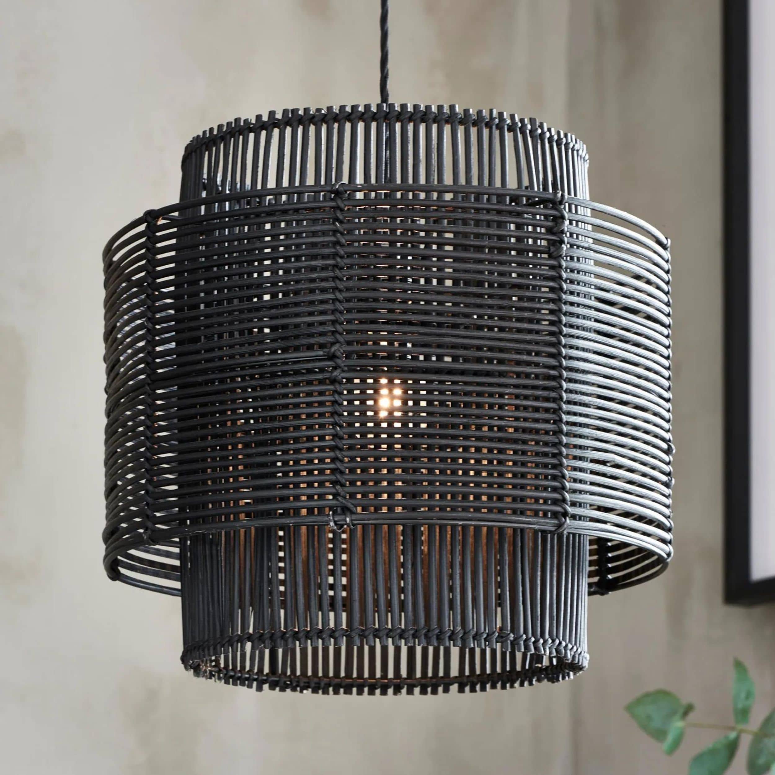 woven black pendant lamp with intricate detailing, ideal for stylish home decor.