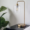 A modern table lamp on a bedside table to help out the big light in a cozy bedroom layout.