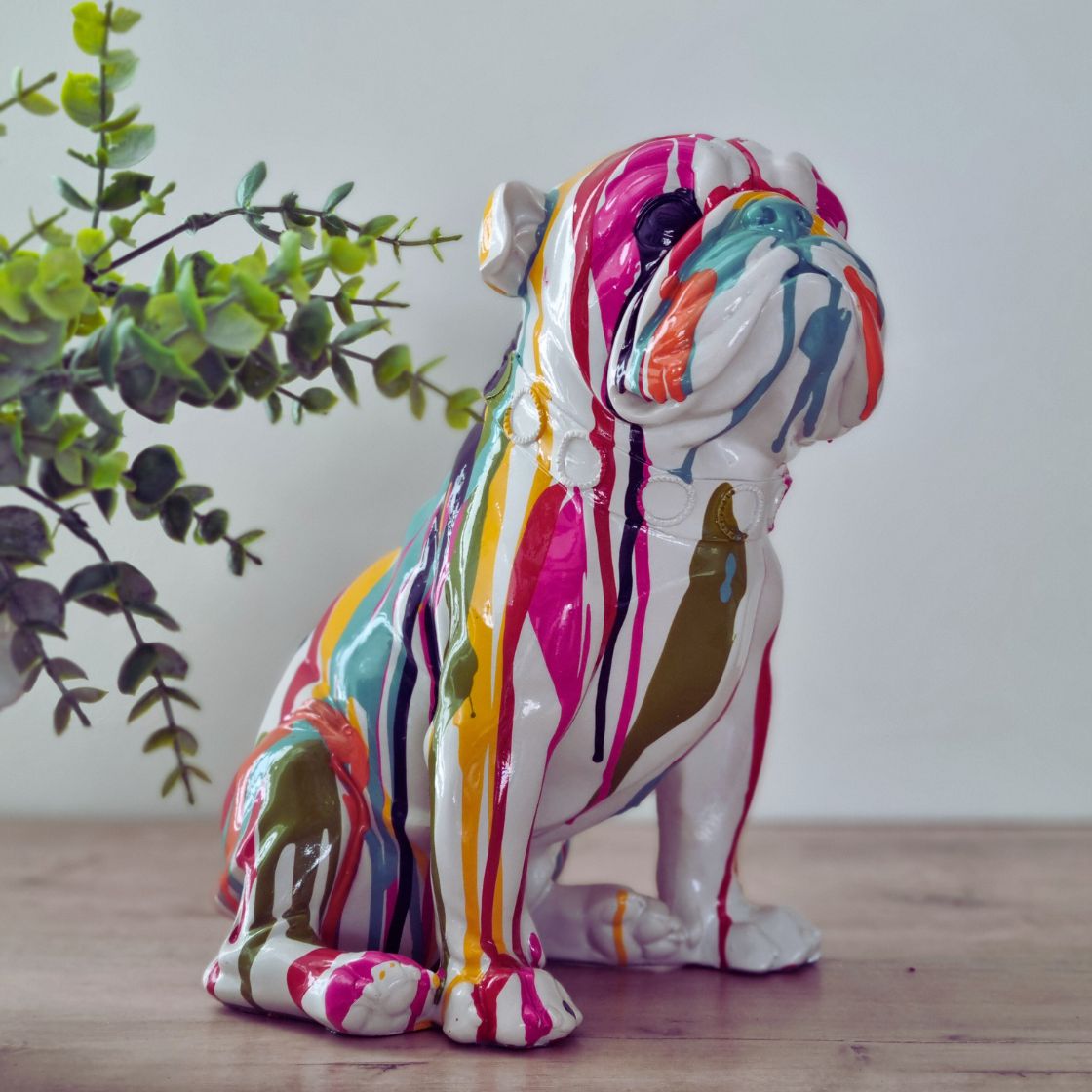 Colourful home decor accents to create a vibrant home interior, featuring a multi-coloured ornament in a neutral space 