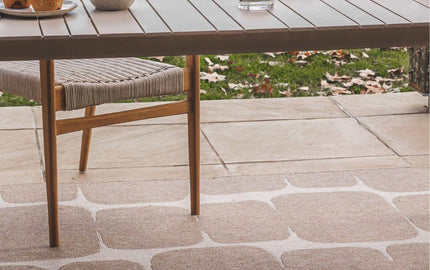 Durable, weather-resistant indoor-outdoor rugs in neutral tones by Woodka Interiors