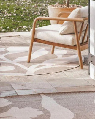 Durable, UV-stabilized outdoor rugs in neutral tones styled on a modern garden patio