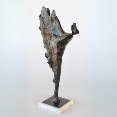 Full view of abstract ornament on marble base displayed in a clear background