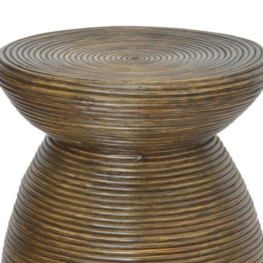 Dark-toned rattan stool with sculptural coiled form. Elegant handcrafted natural rattan stool for modern earthy spaces.