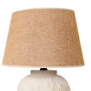 Elegant ceramic side lamp with leaf design and beige shade.