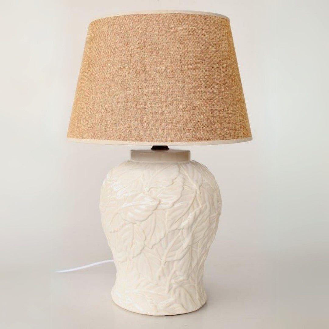 Nature-inspired table lamp with ceramic base and soft glow.