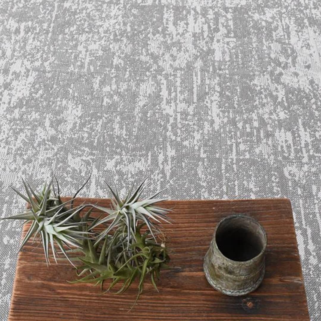 Azulejo Pewter Area Rug with a weathered geometric pattern in pewter color, enhancing home decor in living rooms, bedrooms, or dining areas.