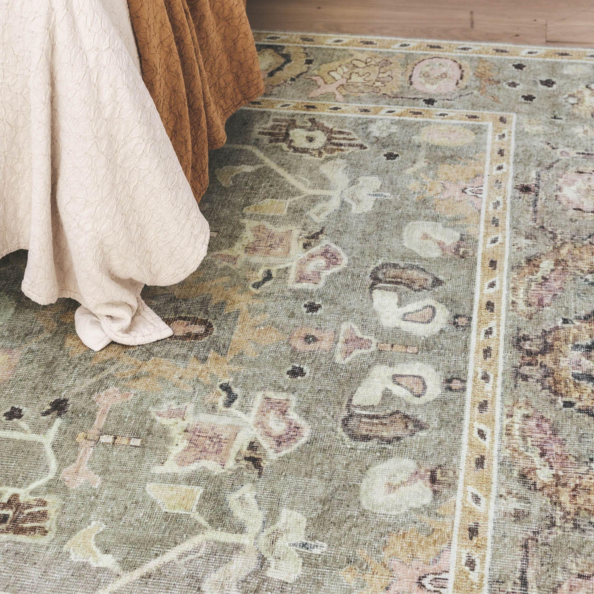 Baroness area rug in blush in bedroom