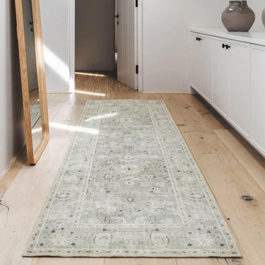 Baroness long runner rug on a wooden floor in entrance by Woodka Interiors