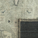 Baroness close-up of a textured rug with a  transition from patterned to solid colour.