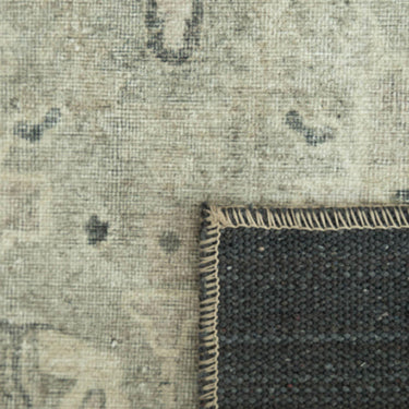 Baroness close-up of a textured rug with a  transition from patterned to solid colour.