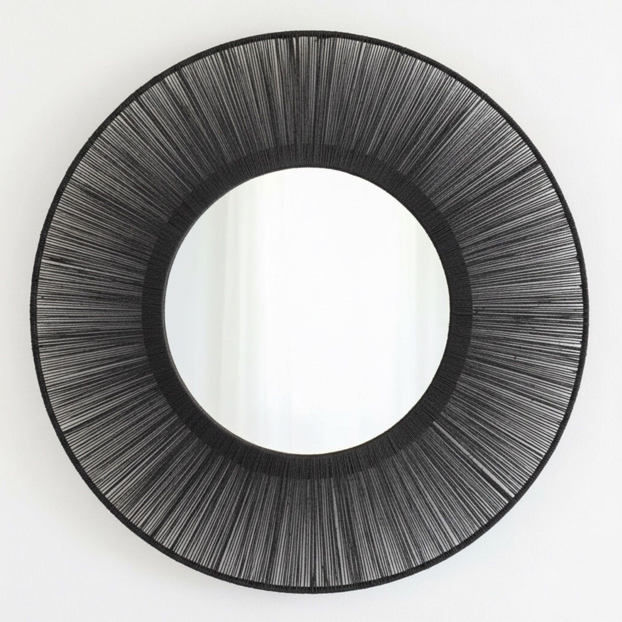 Round mirror with black jute frame design 