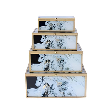 Marble-style decorative boxes stacked on display