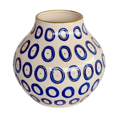 Blue ceramic vase with gold circle accents and gold-trimmed rim for home decor.