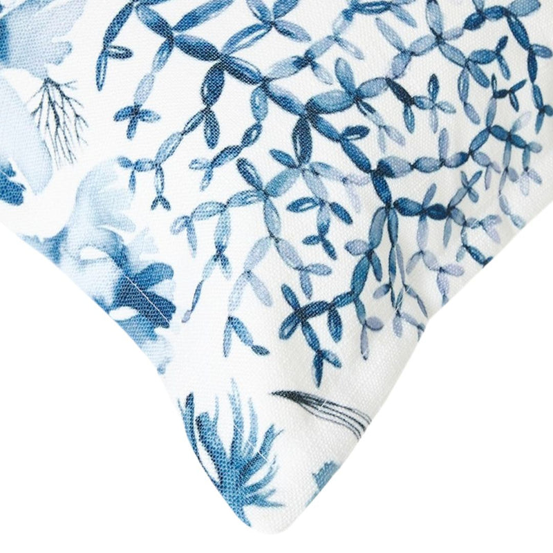 close-up detail of the soft and durable fabric on the Blue Coast Shells cushion, showcasing the detailed blue marine print of sea life.