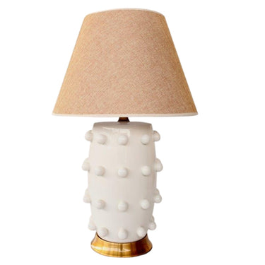 Modern table lamp with ceramic bobble design and brass stand.