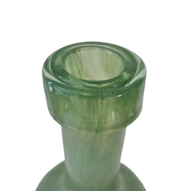 Green glass vase on a white background