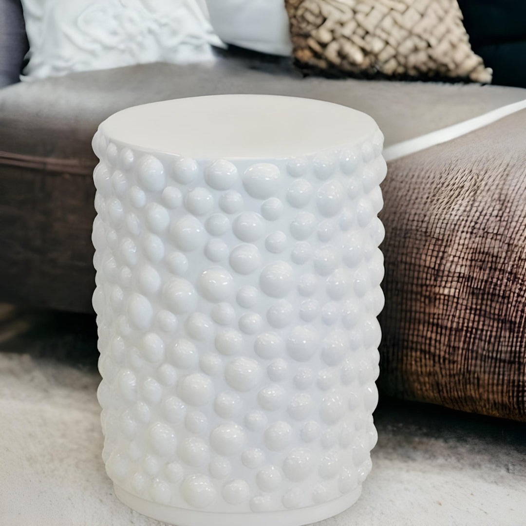 Bubble White Ceramic Stool used as a side table