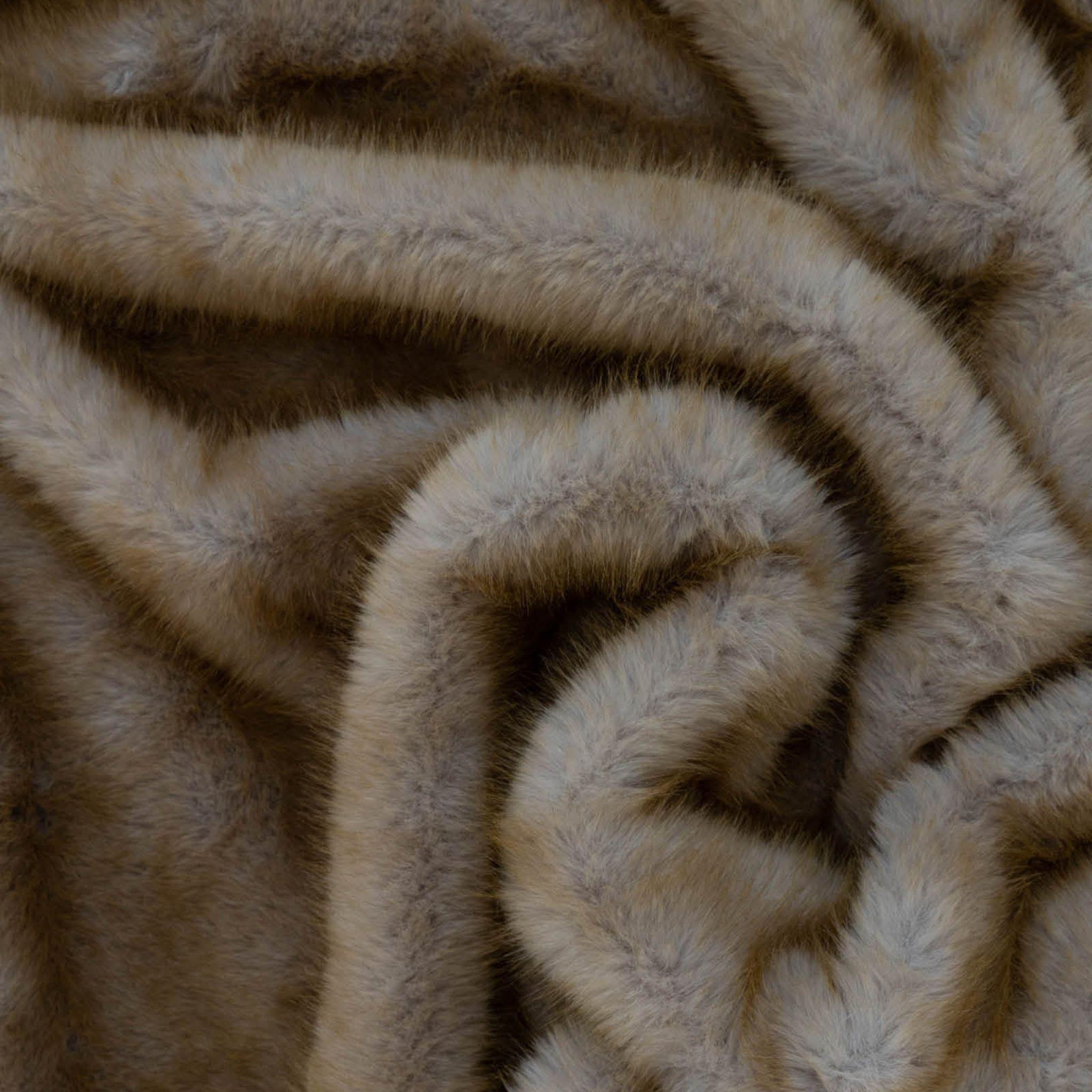 Caracul faux fur throw close-up of  the beige fur fabric texture