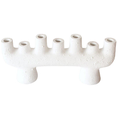 Ceramic candle holder with a snow-glazed frosted finish, holding seven standard dinner candles.