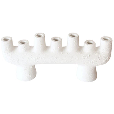 Ceramic candle holder for seven candles, perfect for creating a warm ambiance.