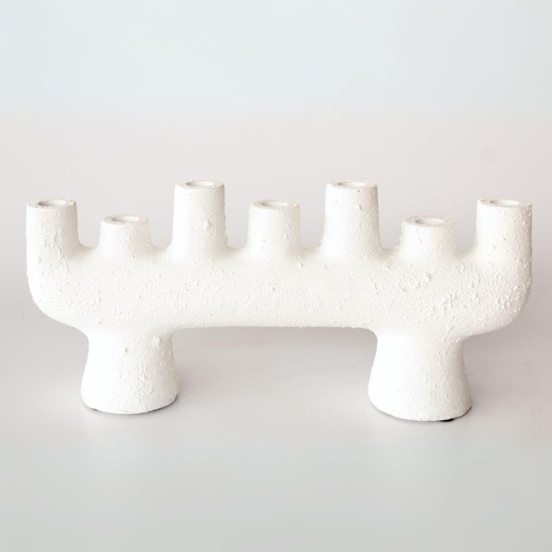 Stylish ceramic candle holder with a minimalist design and textured surface