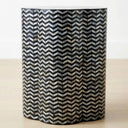 Chevron shell inlay side table with black base and iridescent pattern.