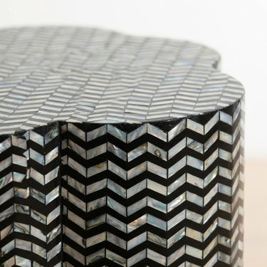 Chevron shell inlay side table edge with black base and iridescent pattern
