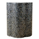 Chevron shell inlay side table with black base and iridescent pattern.