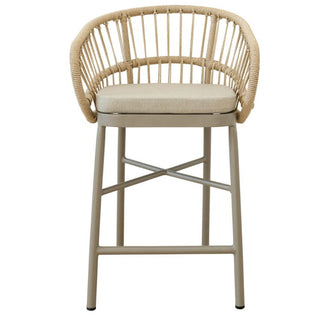 Lola counter stool in Corfu Dune with rattan weave, black powder-coated aluminium frame, and cushioned seat for indoor-outdoor use.