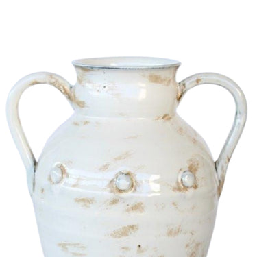 Farmhouse style ceramic vase with two handles for living room display.