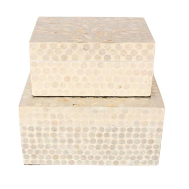Two capiz shell decorative boxes in cream and ivory with a dotted pattern.