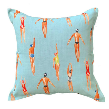 scatter cushion with a retro pattern of illustrated swimmers diving and floating in light turquoise blue water 