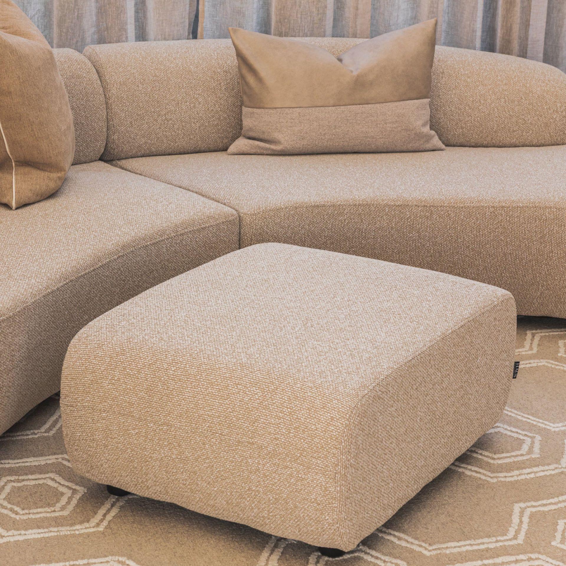 Echo Ottoman in Hertex Pascal Oats with a rectangular shape and rounded corners