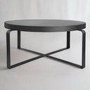 Modern metal coffee table and round side tables by Woodka Interiors.