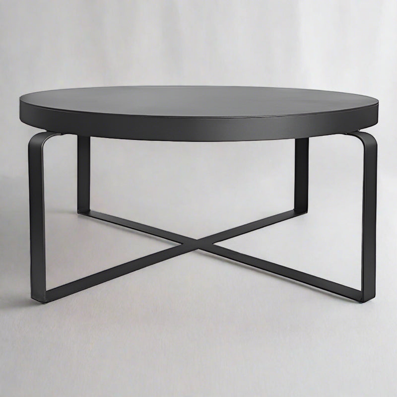 Modern metal coffee table and round side tables by Woodka Interiors.