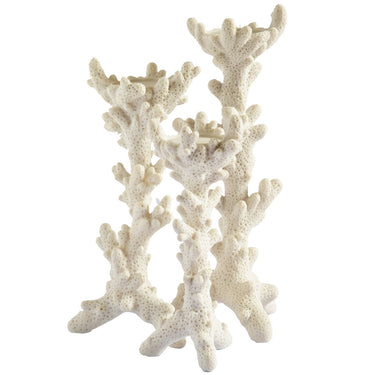 White candle holders in varying sizes with intricate coral-like detailing, perfect for tabletop décor.