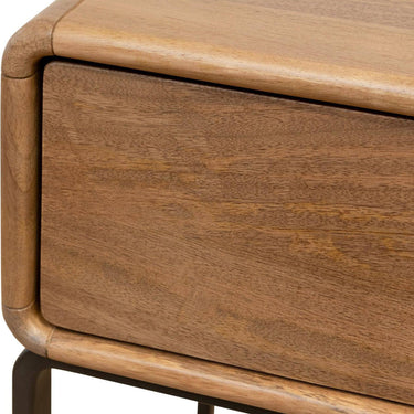Close-up of a florida nighstand wooden drawer with a focus on texture and finish.