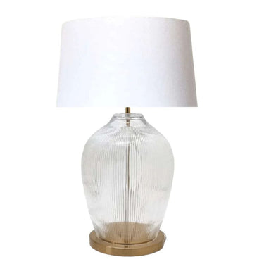 Modern fluted glass lamp with a brass base, perfect for your home.