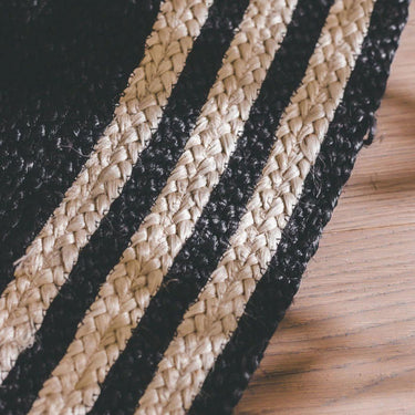 Close-up of hand-stitched details on French Riviera Round Rug in Noir