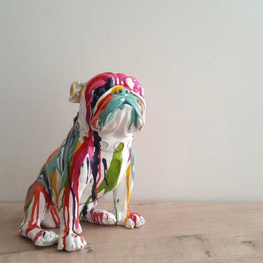 Colourful Frenchie Bulldog ceramic dog statue on a shelf.