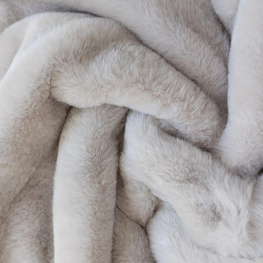 Frostveil Fur throw with frosted faux fur texture and soft mink backing, shown in snowflake.