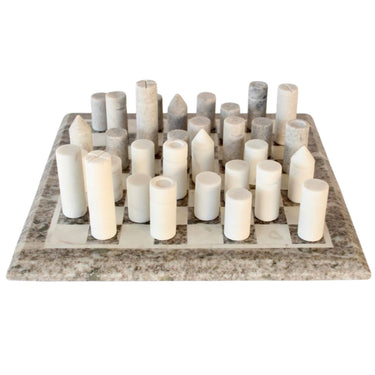 Gambit modern marble chess board game set with minimalist cylindrical stone pieces from Woodka Interiors