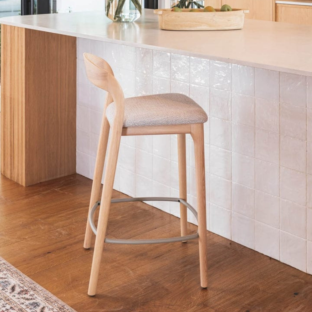 Grace Counter Chair with a sleek ash wood frame paired with luxurious seats.