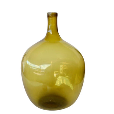 Elegant bottle vase in green glass for modern interiors.