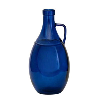 Handled  jewel-toned blue glass vase  by Woodka Interiors