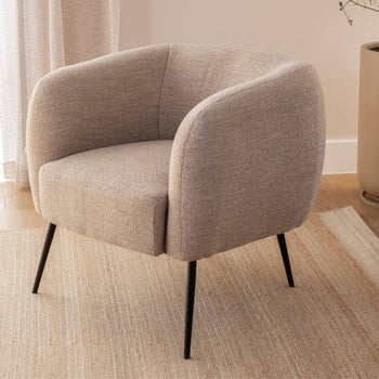 Hush solo occasional chair with soft, plush upholstery and inviting shape.