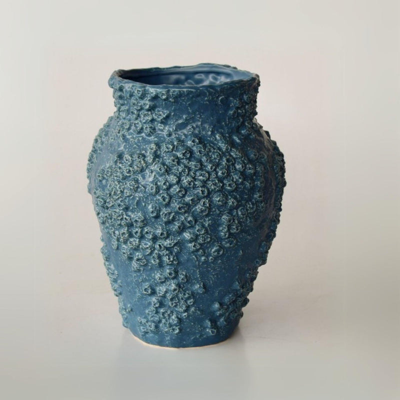 Dark blue ceramic vase with natural Barnacle detailing at the base