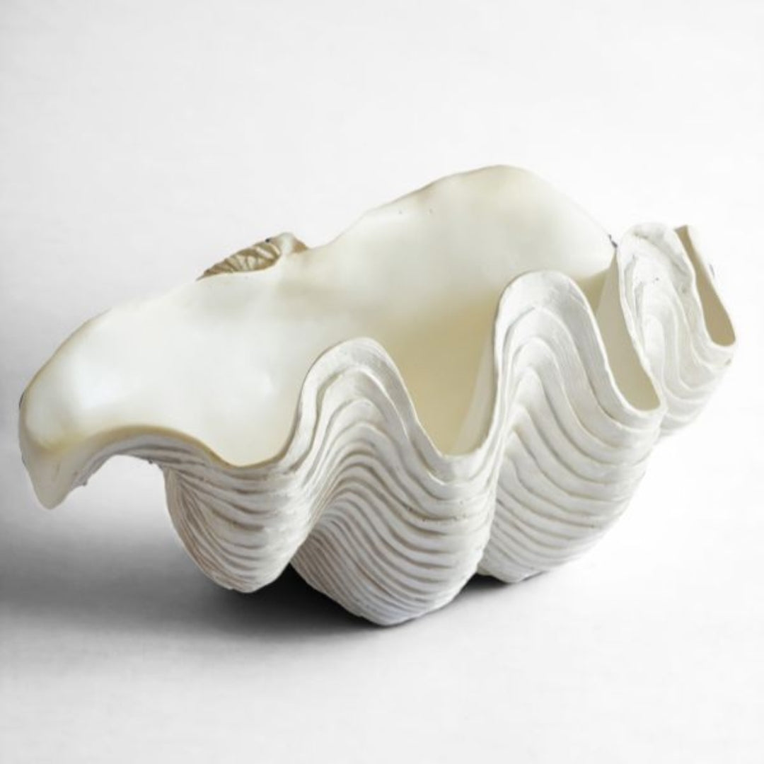 A giant clam shell decor bowl is sculptural resin with realistic detail, perfect for towels, fruit or decorative styling